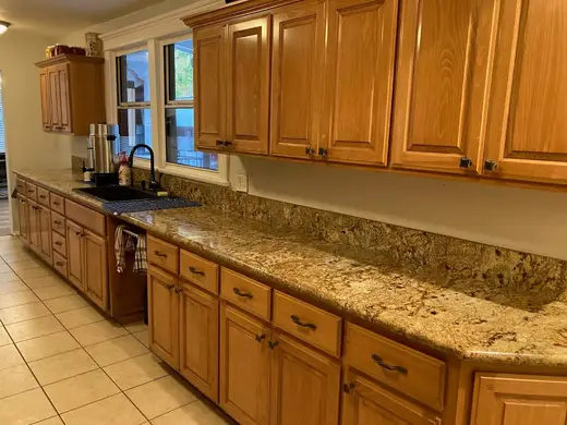 Modern kitchen with granite countertops at New Life House, a sober living home in Los Angeles.